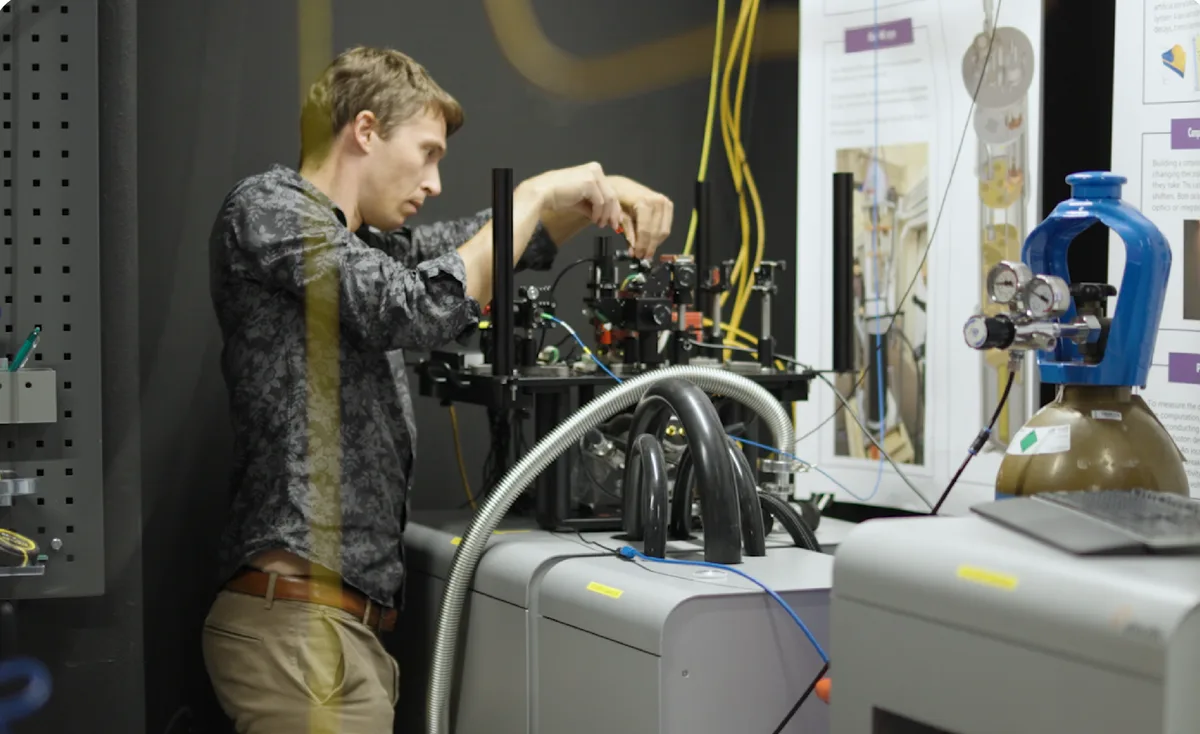 A researcher working on lab equipment at Copenhagen University