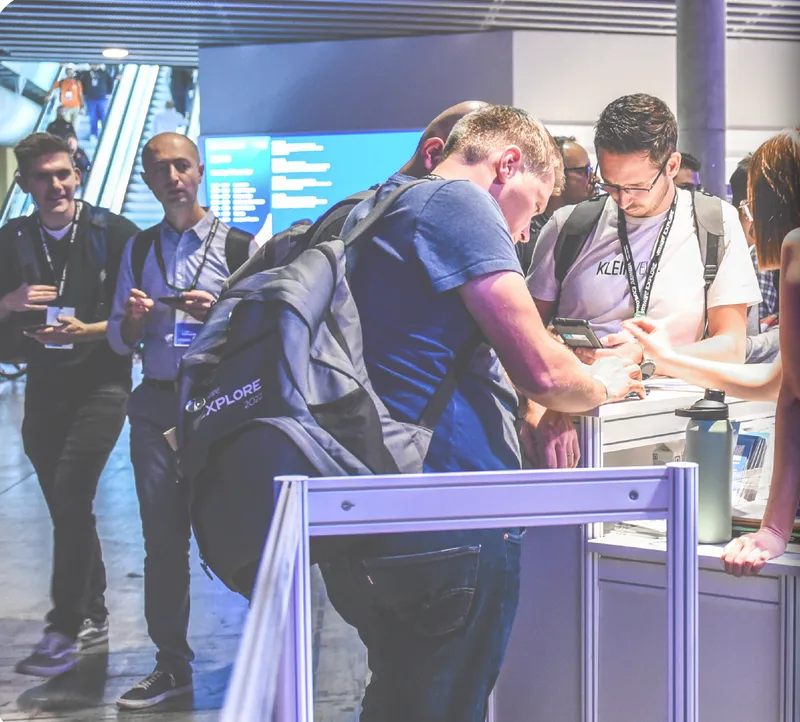 VMware Explore attendees at the rewards stand